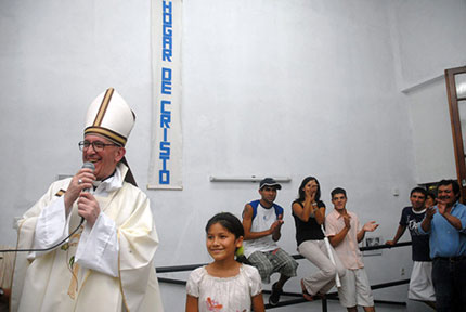 Then Cardinal Jorge Mario Bergoglio of Argentina offers a Holy Thursday mass in the Hogar de Cristo shelter for drug users, in the Parque Patricios neighborhood of Buenos Aires, March 20, 2008. (Reuters)