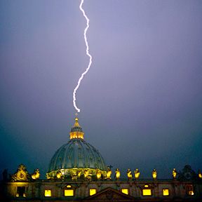 A lightning strikes St Peter's dome at the Vatican on February 11, 2013. Pope Benedict XVI announced today he will resign as leader of the world's 1.1 billion Catholics on February 28 (AFP Photo / Filippo Monteforte) 